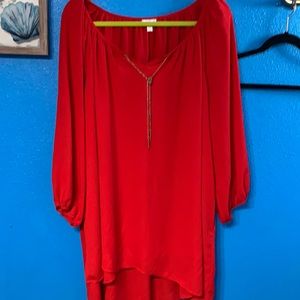 Red Avenue Blouse with chain neckline.